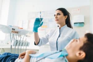 Female dentist with syringe, pediatric dentistry