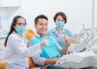 Supportive dental team in Strathfield giving a thumbs up
